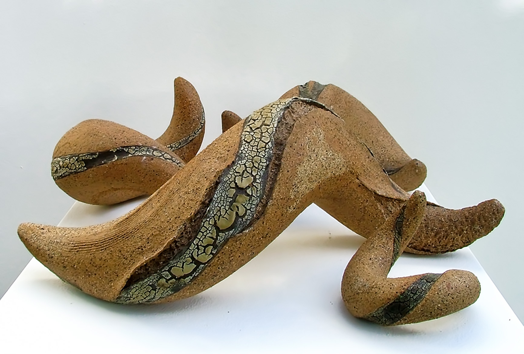 Several curvacious twisting sculptures with interesting cracked glazes