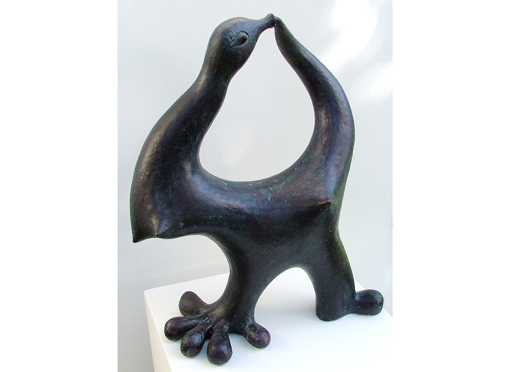 Ceramic sculpture with bird head and big foot