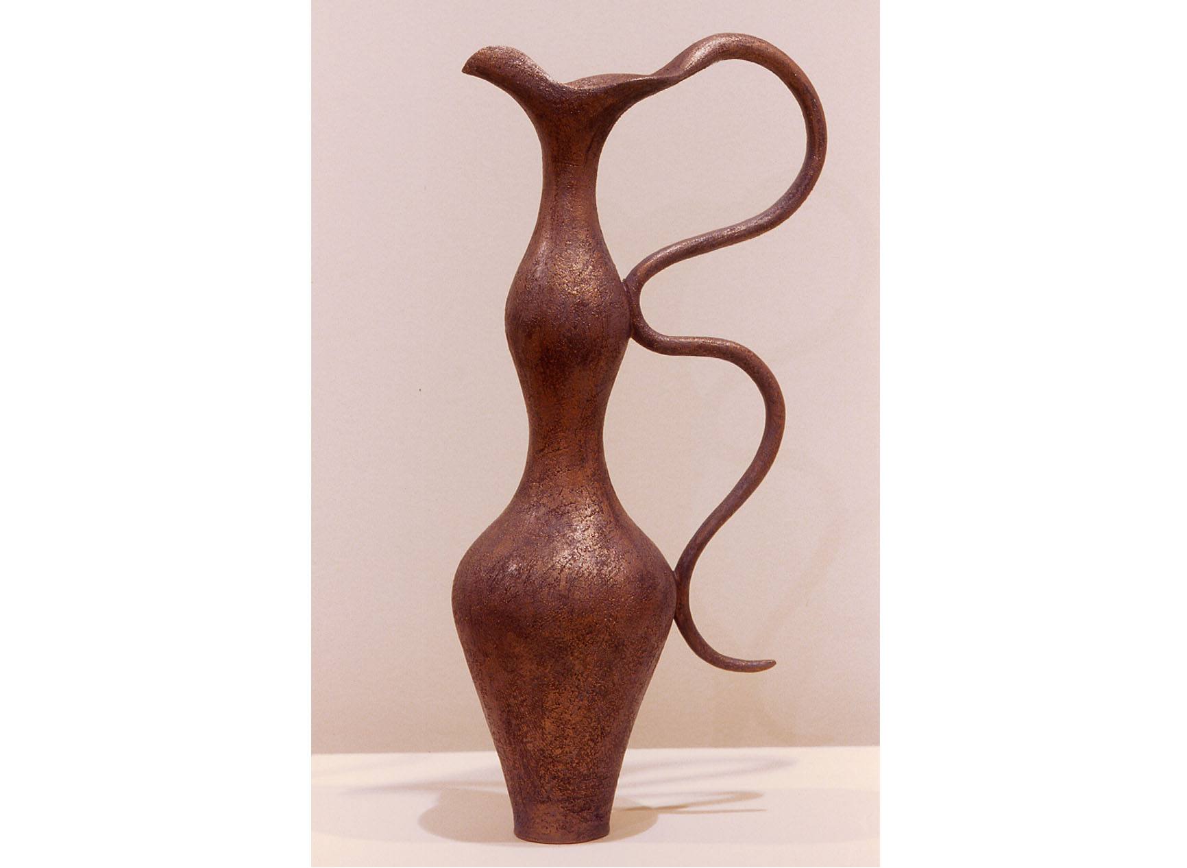 Curvacious vase with curvacious handle called Dancing the Shadow