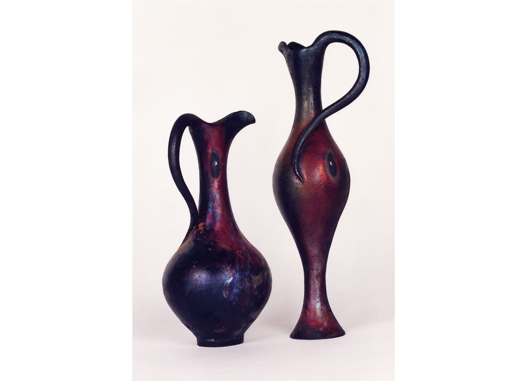 Two curvacious vases, raku fired, called Eyes of the Tiger