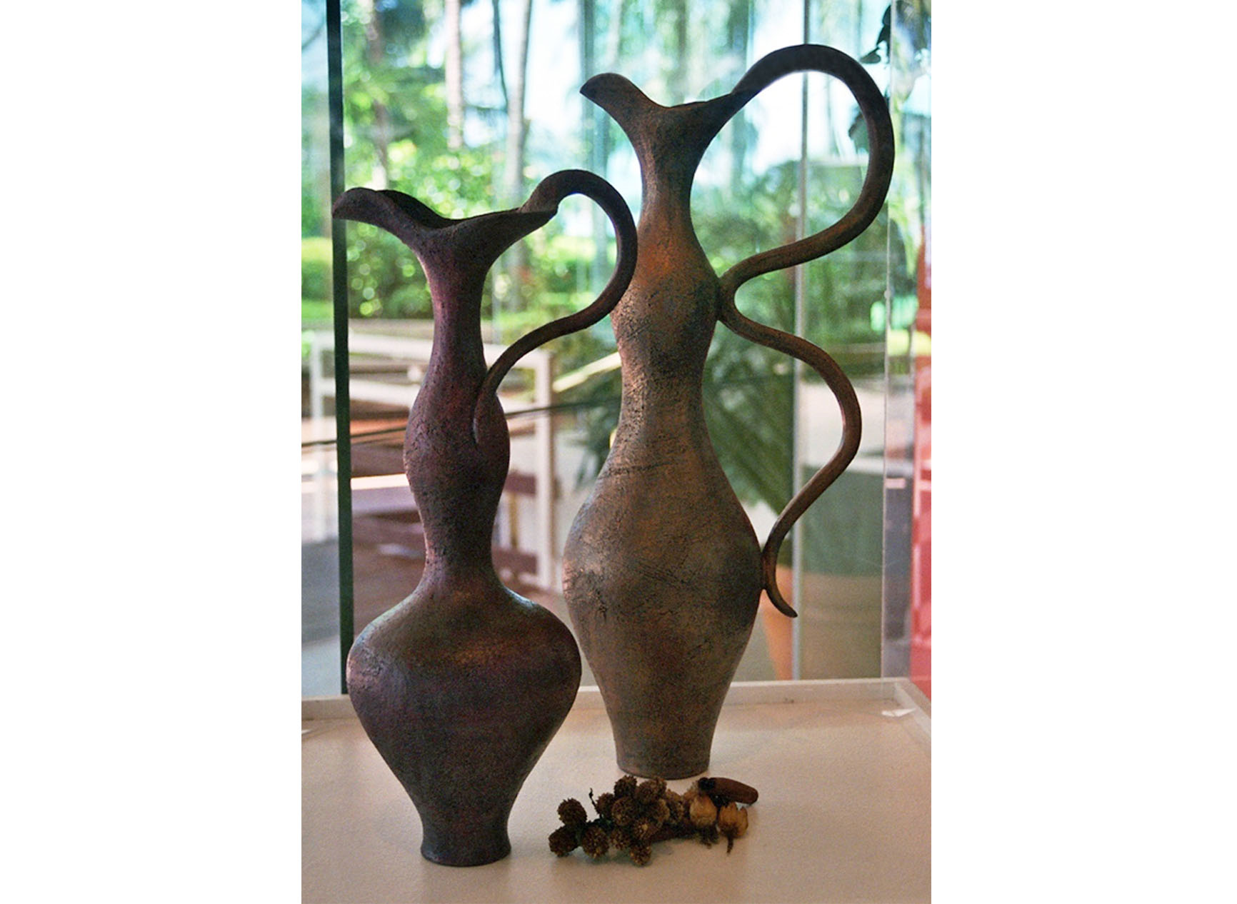 Two very curvacious female form vases in a glass case in The Hilton Hotel, Cairns